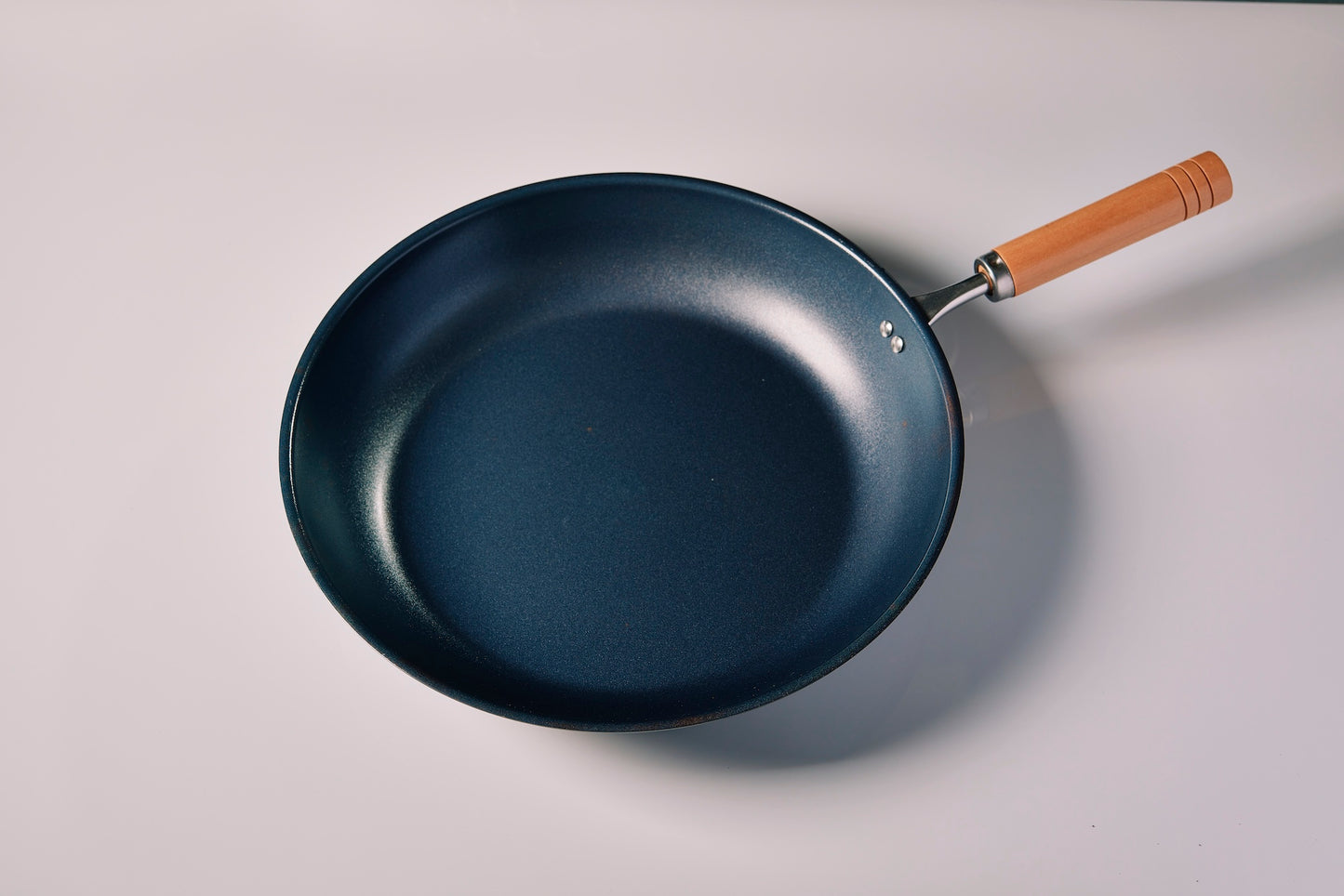Nano-embossed iron pan